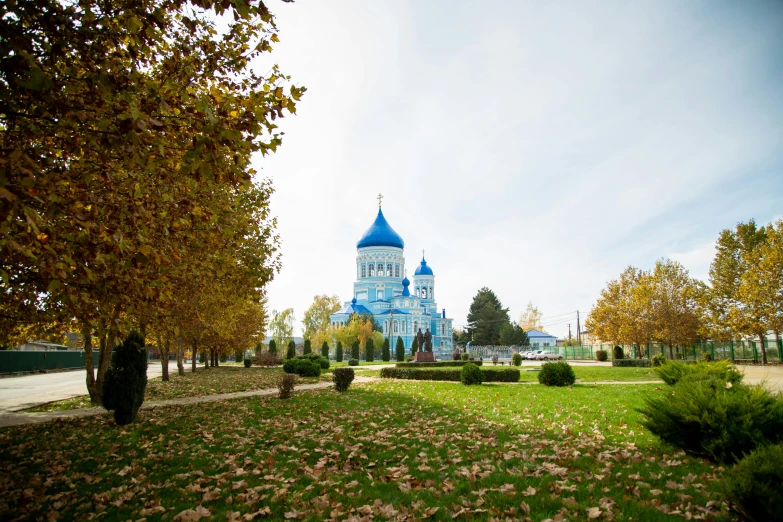 the large cathedral in this landscape is the color blue