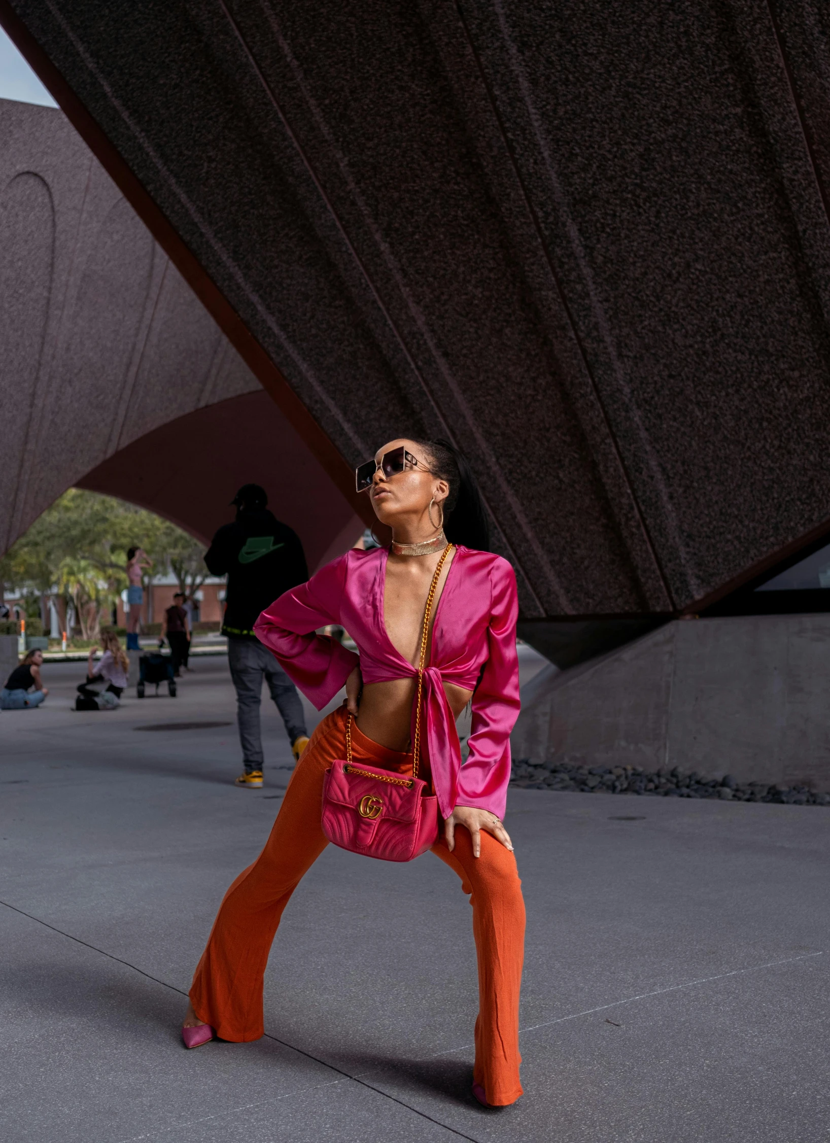 a woman standing outside in bright clothing