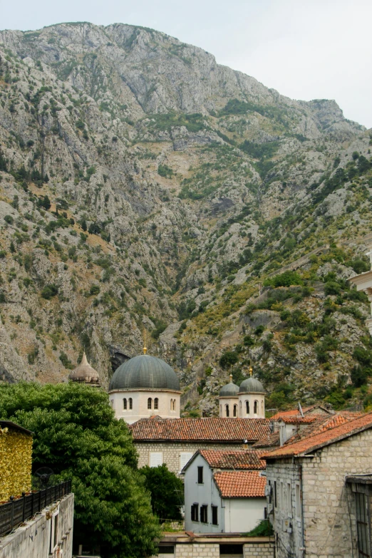 old style town in the mountains with buildings