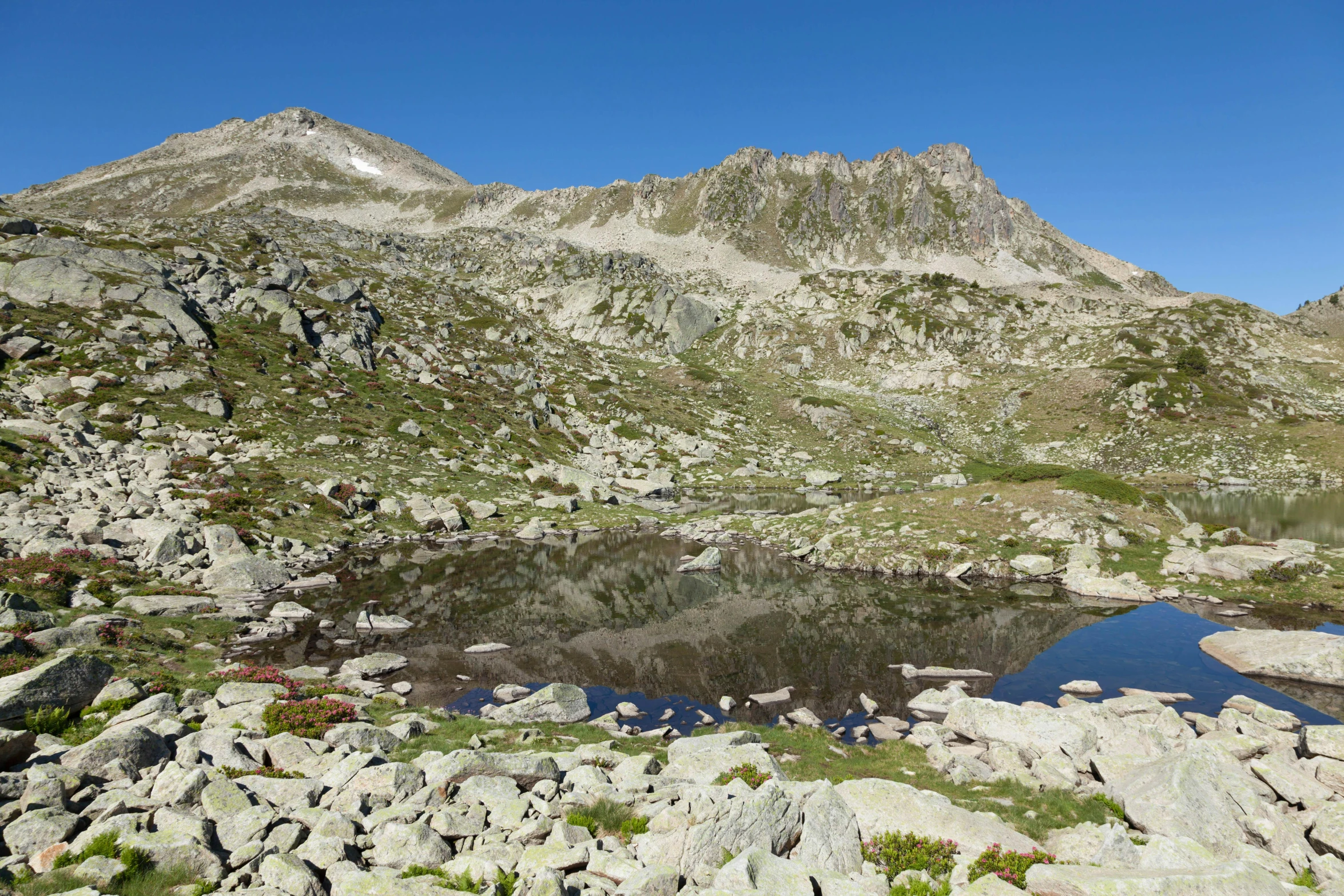 a mountain lake with mountains in the background