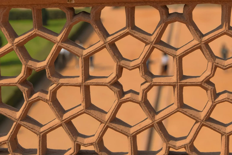 a close up view of a patterned design on an iron railing