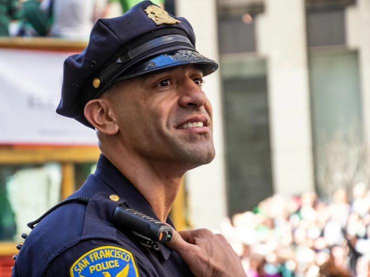 an officer in uniform is standing near the street