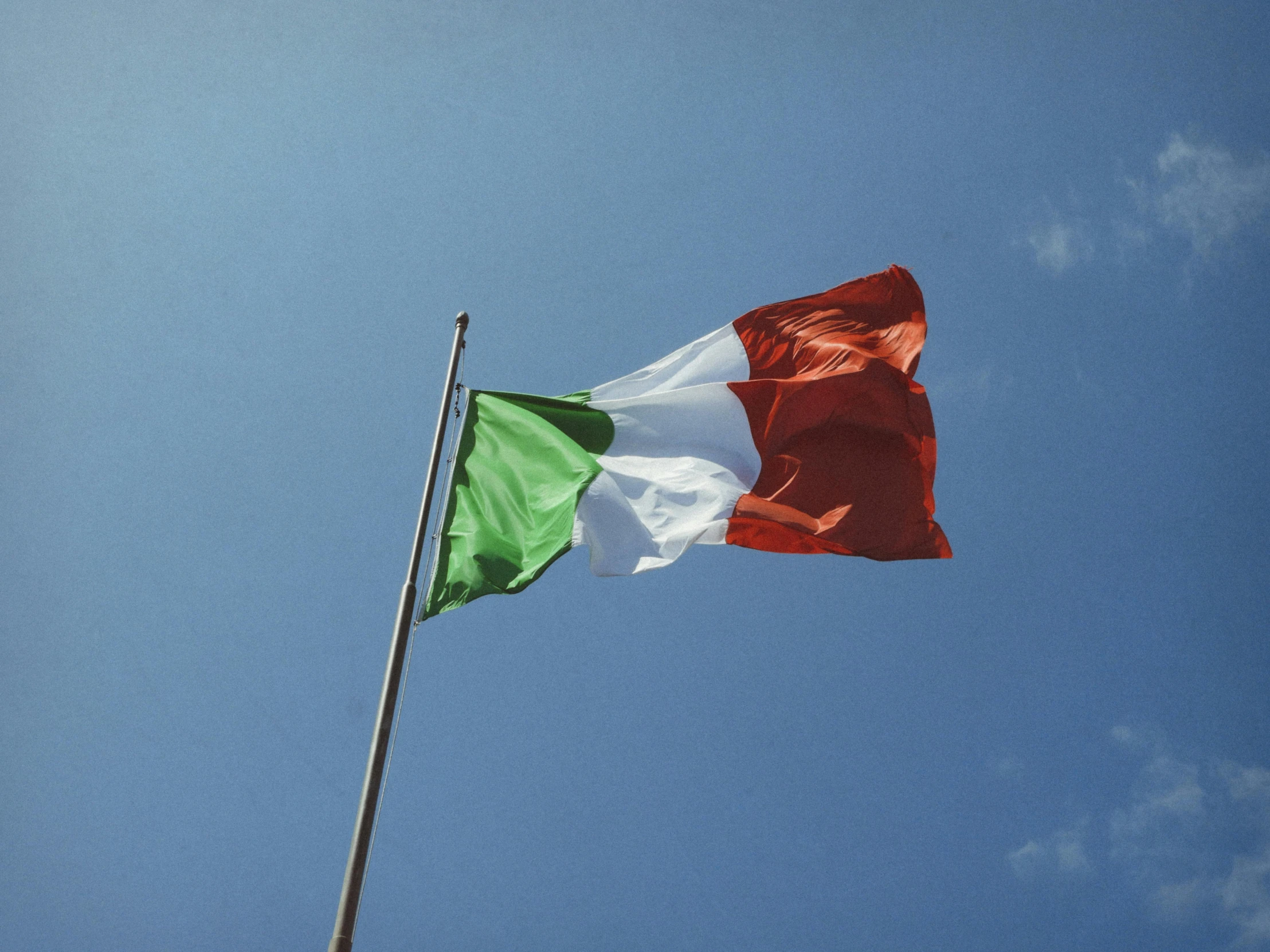 two colors on a flag fly together in the wind