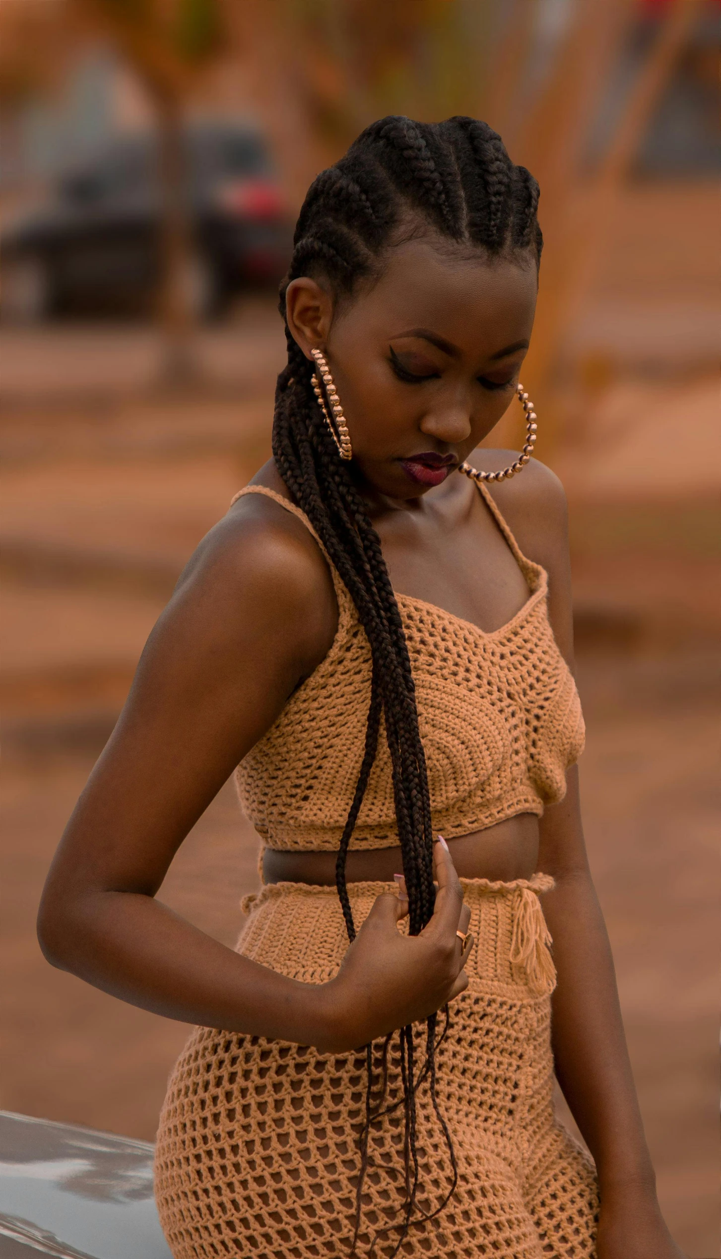 a young woman looking down at her cell phone