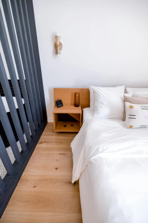 a bedroom with a bed and desk sitting next to it