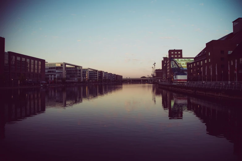 a canal running between several buildings in a city