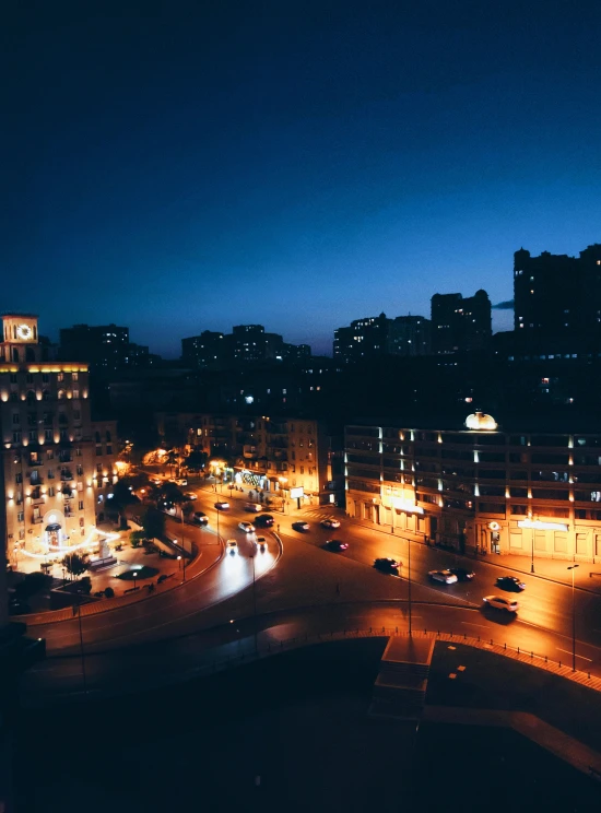 night view of a street and skyscrs in a city