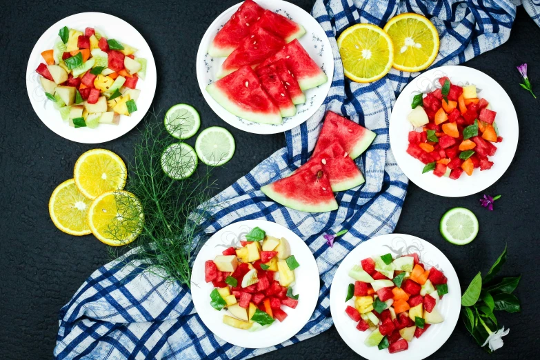 plated salad, watermelon, citrus and limes