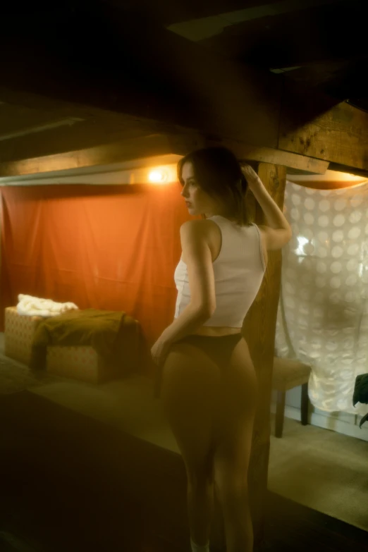 a woman posing for a pograph while in a room