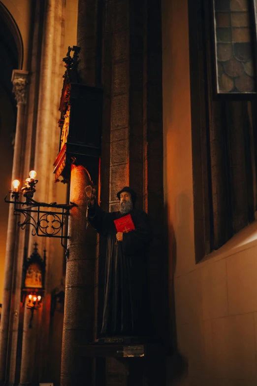 a catholic cathedral with candle lights and statue