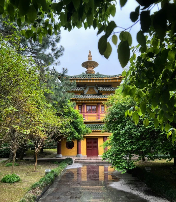 a beautiful building with some trees and rocks