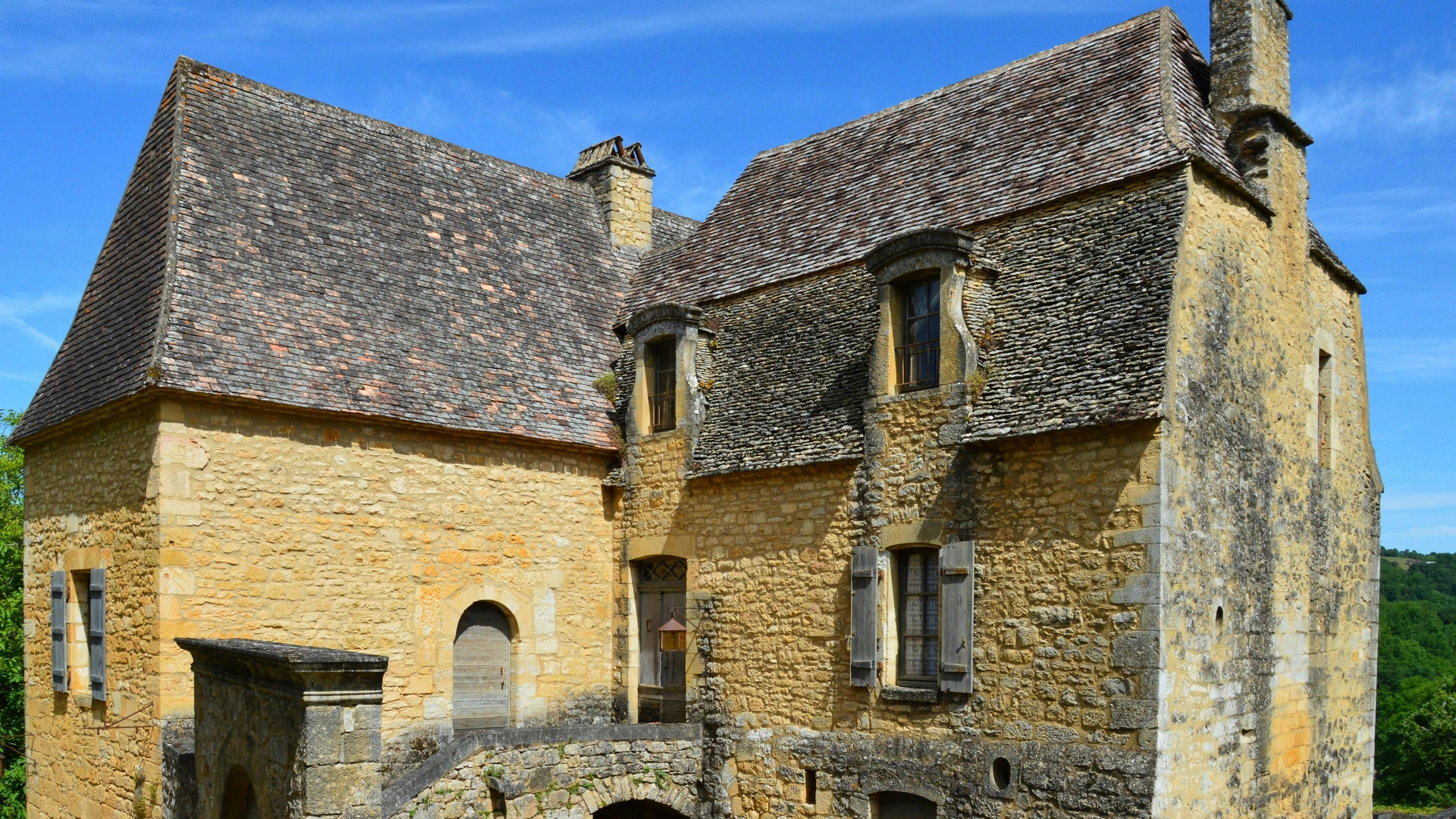 an old church that looks like it was built around the bend in an old castle