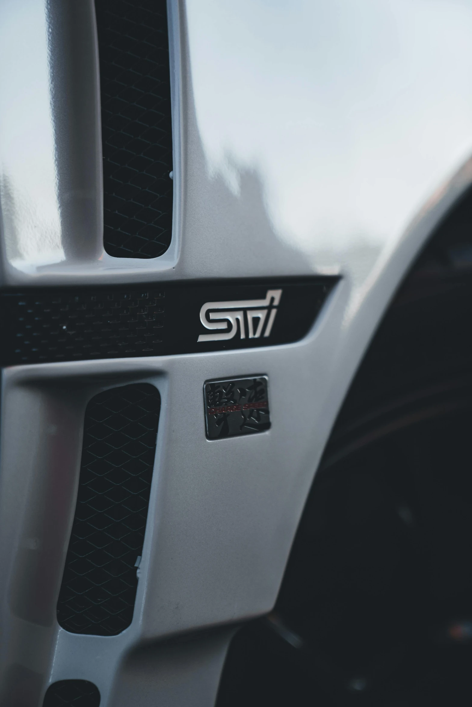 a close up view of the front bumper and emblem on a vehicle