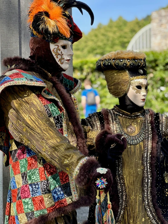 two people in costumes stand close together