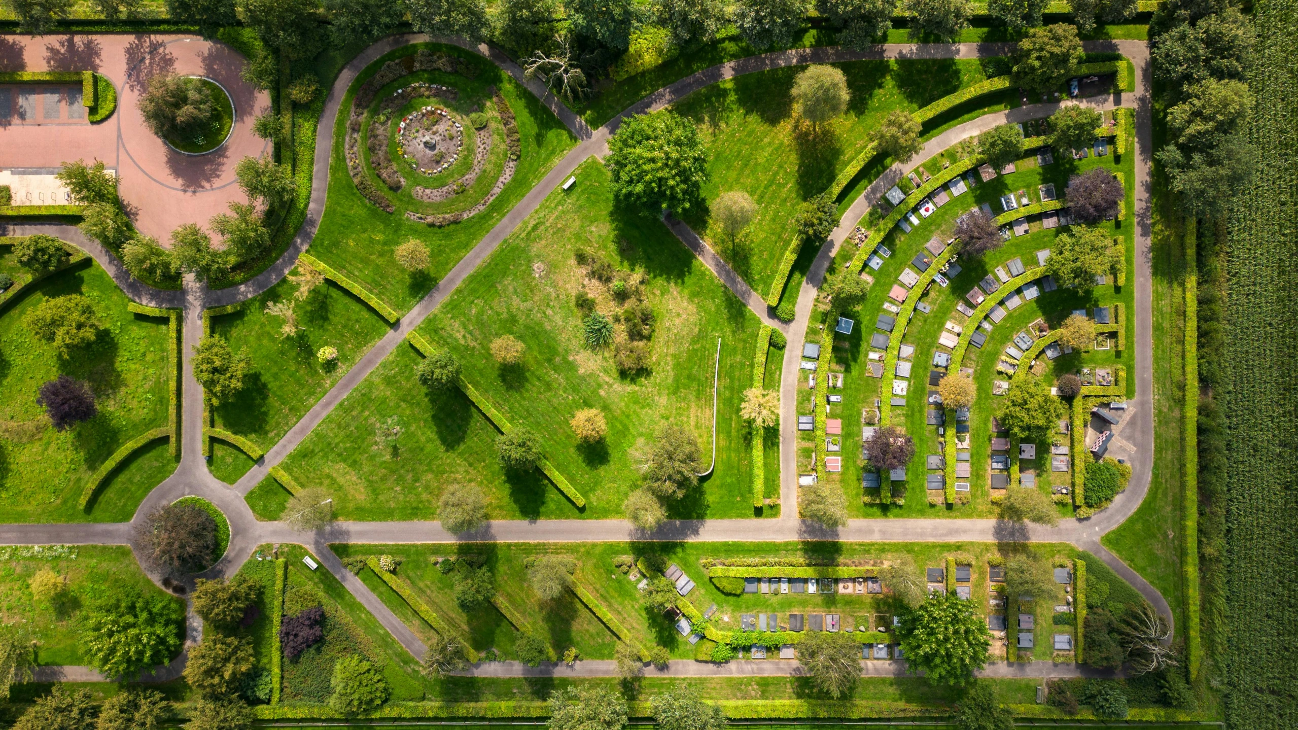 an aerial view of the green area with many trees and other plants