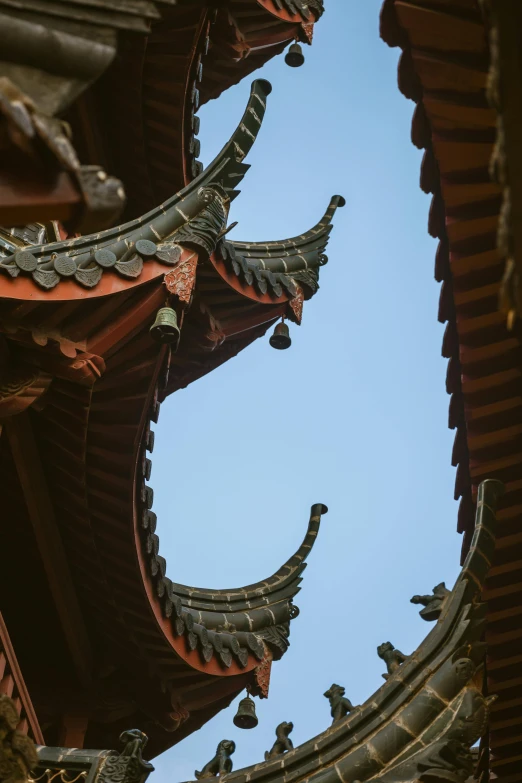 the structure of a chinese building with many arches and shapes on it