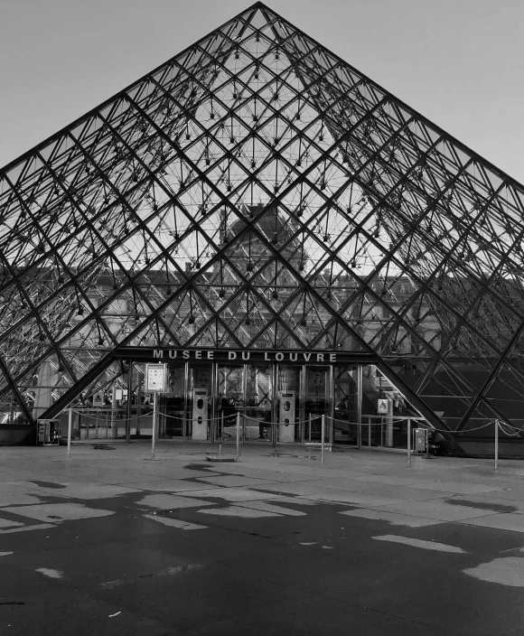 a pyramid shaped building that is outside of a city