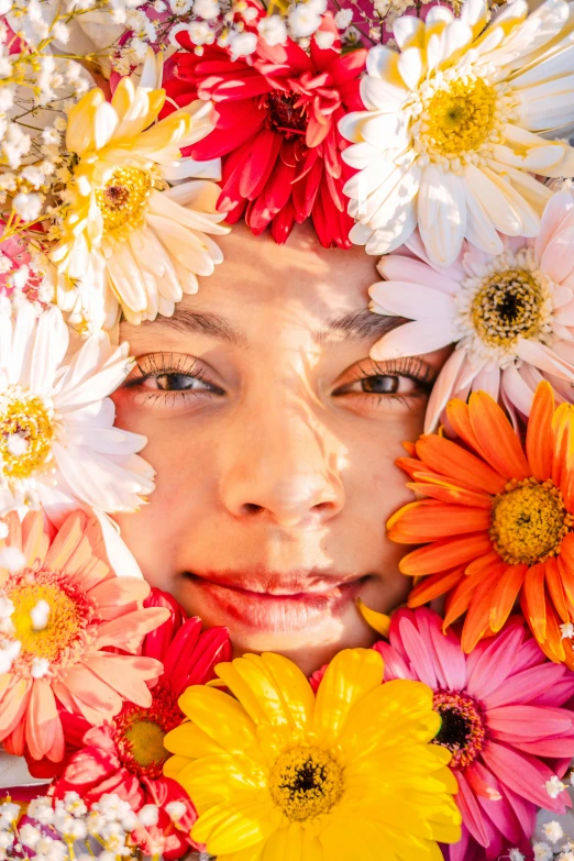 a woman with multi colored flowers in her face