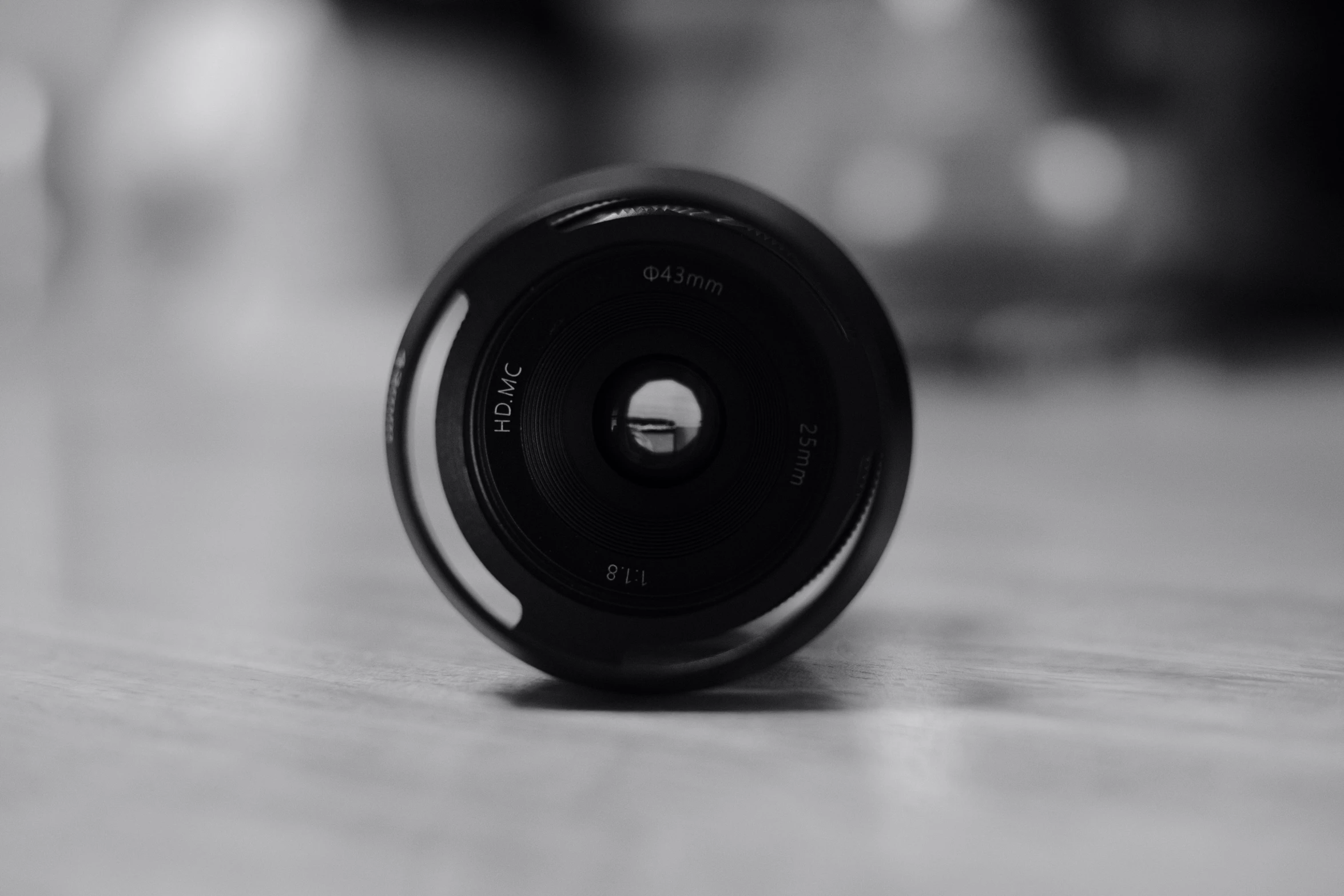 the lens of an old fashioned camera on the floor