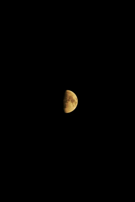 the moon seen in the night sky in a cloudless sky