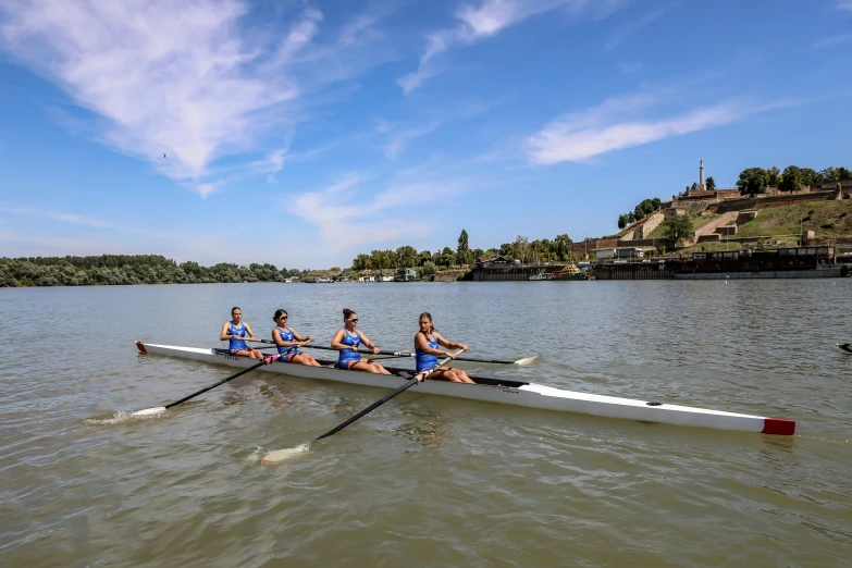 a group of people riding on top of a boat