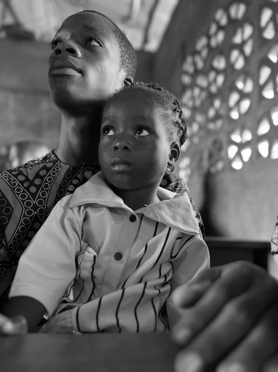 a woman with her child who is looking up