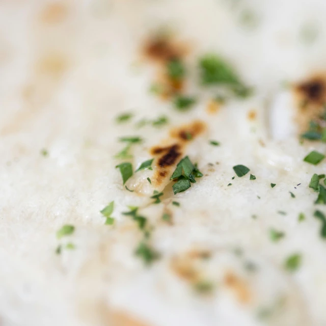 a close up of food that includes green stuff