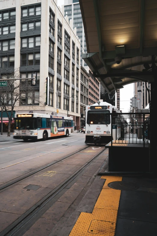 a couple of buses that are parked in the street