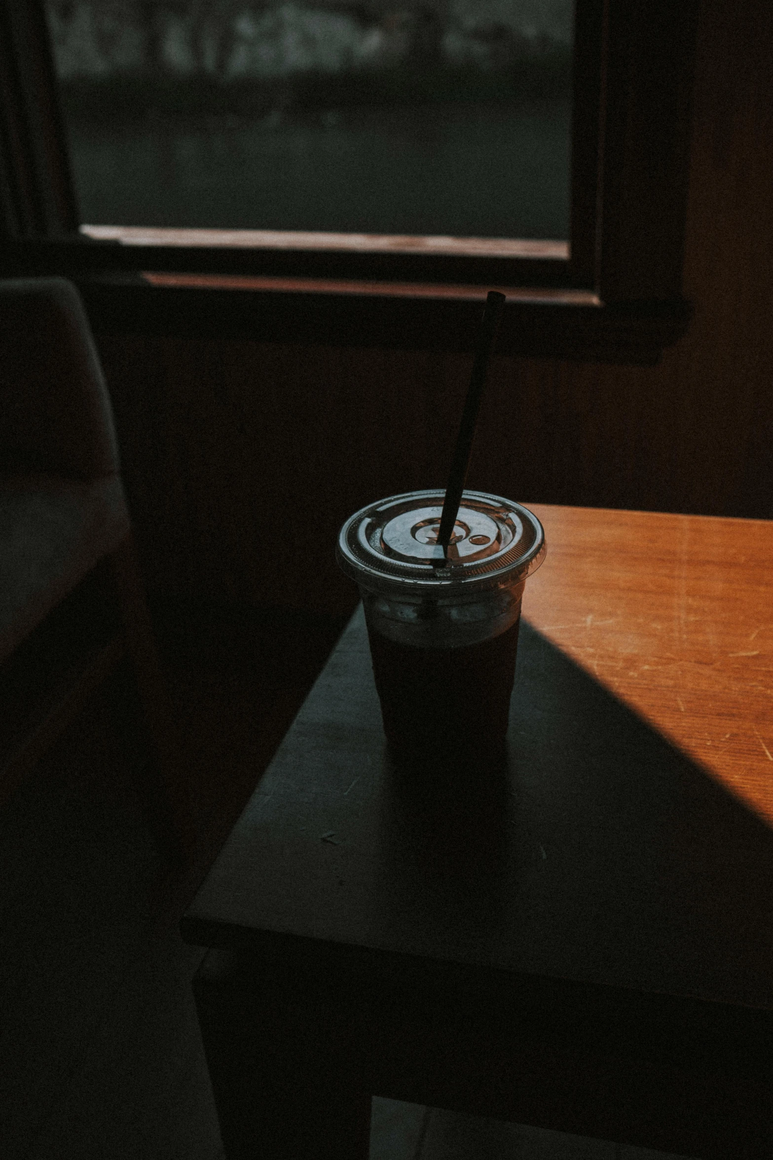 a cup of coffee sitting on top of a table