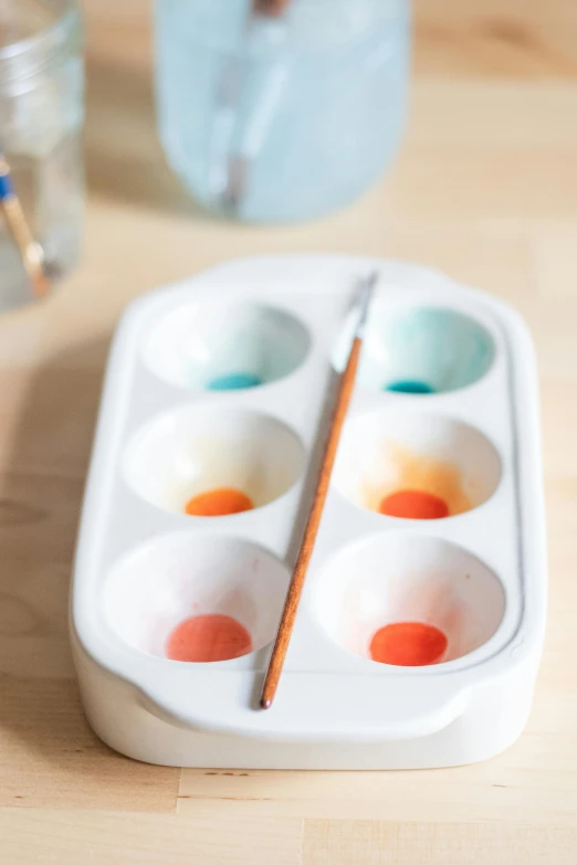 two paint boxes with four different paint colors on them