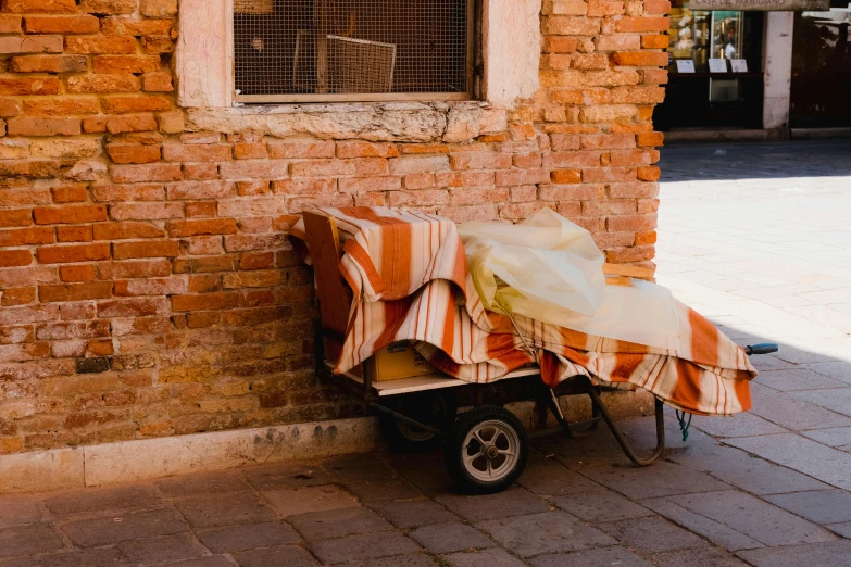 there is a small cart under an umbrella