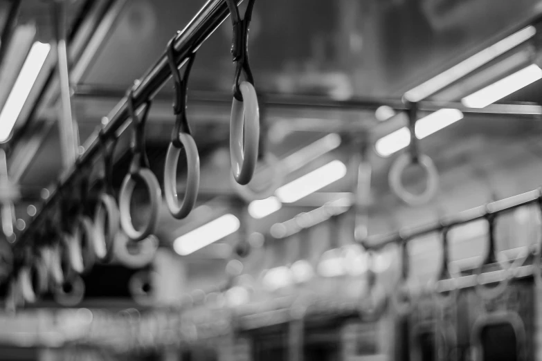 some pans hanging on a pole in the middle of a train