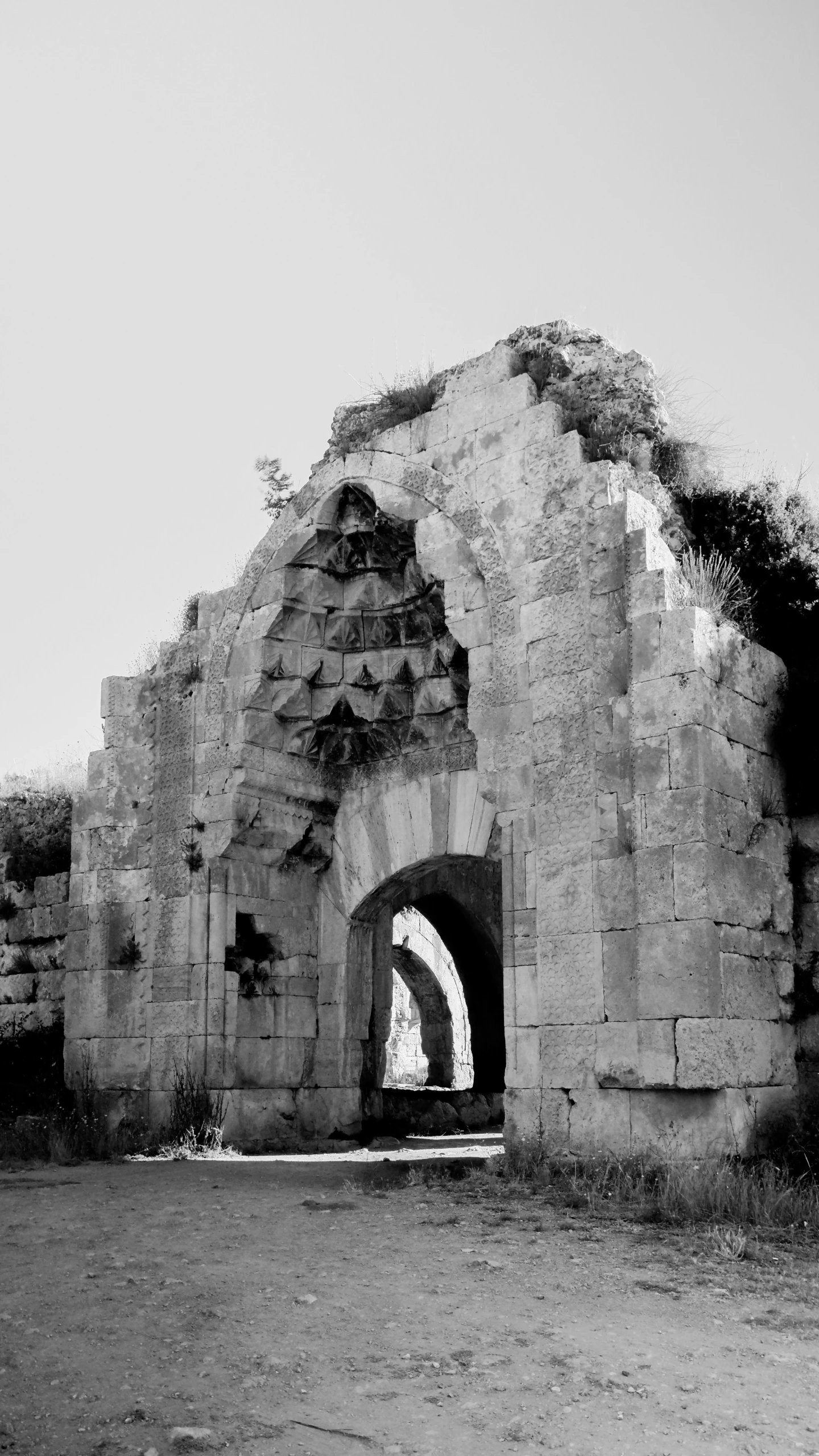 a black and white po of a small cave entrance