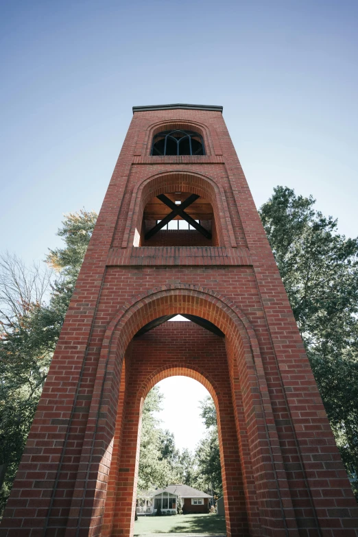 a very large tall brick clock tower