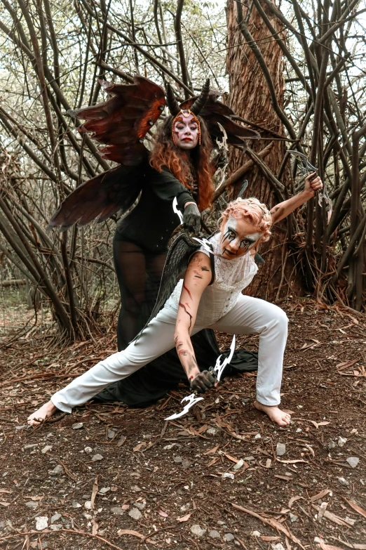 a couple dressed up like witches standing together