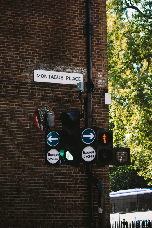 the sign is hanging on the wall of a building