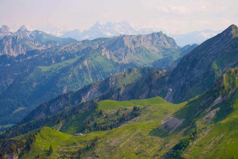 mountains and valleys rise in the background with greenery