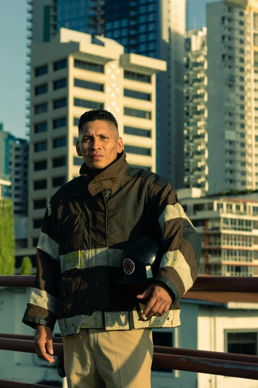 a firefighter standing by some tall buildings