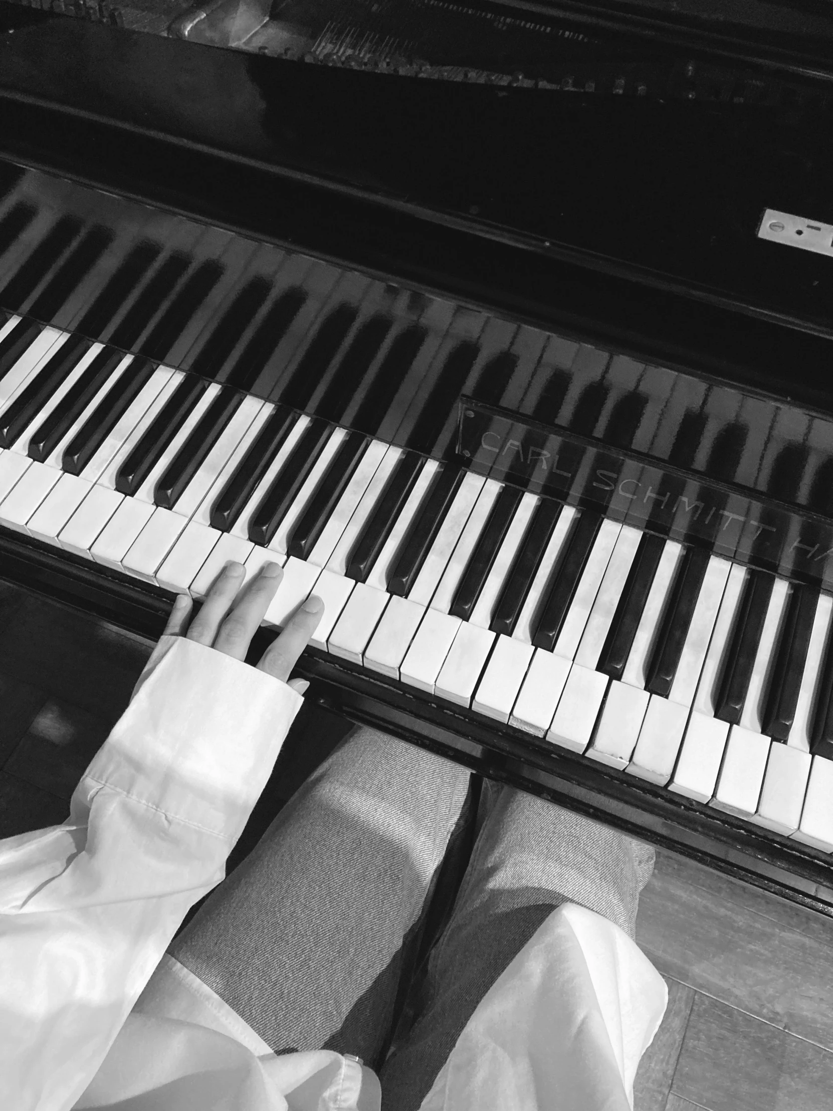 someone's hand resting on an electric piano