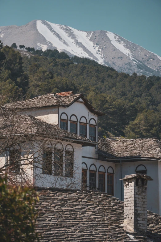 view of a mountain from a large house