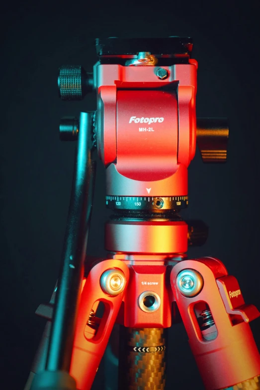 a tripod with two red and yellow lights