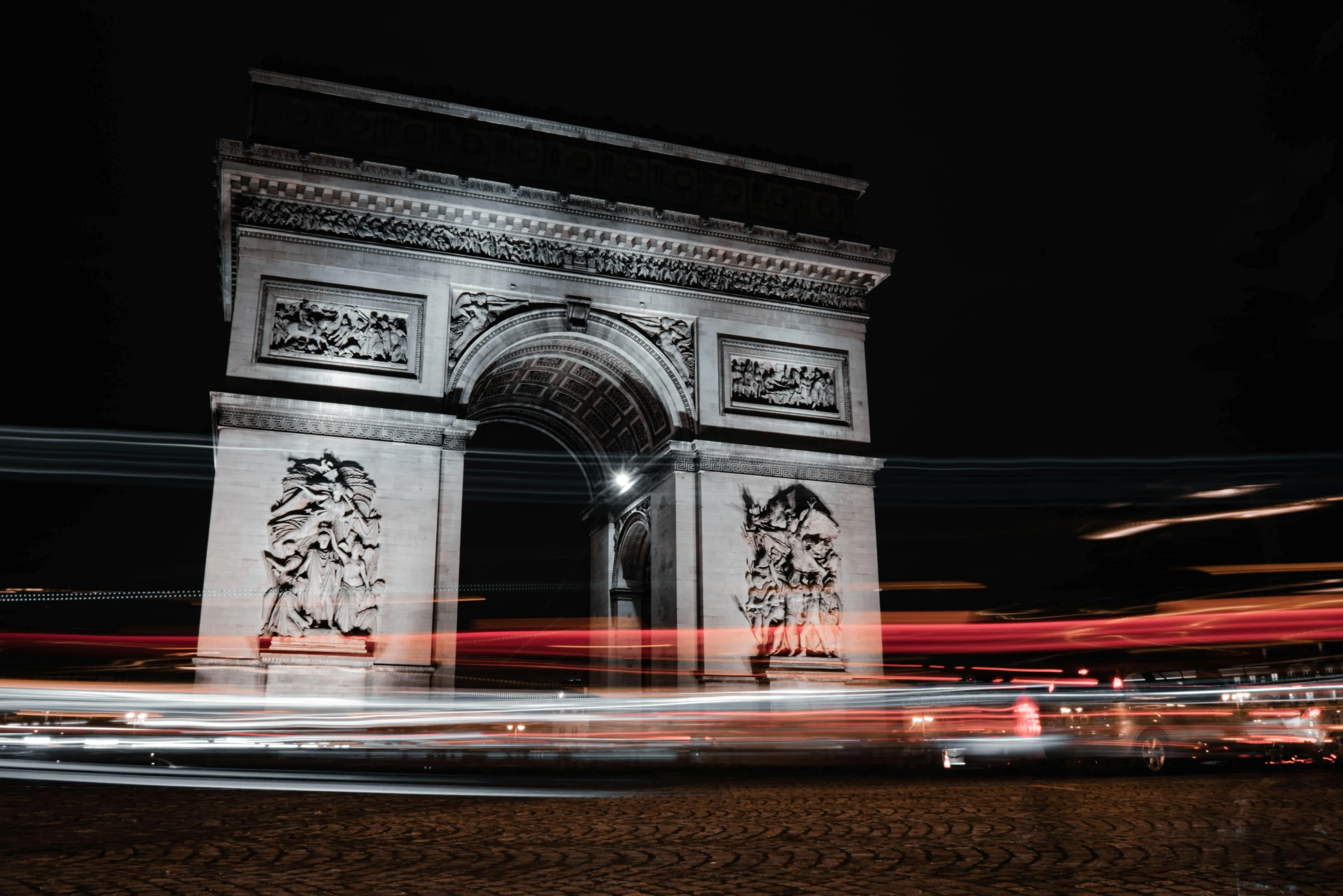 a large monument with carvings on it at night