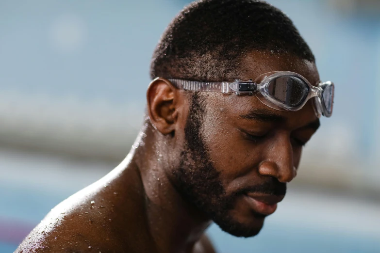 a man with goggles looking into the camera