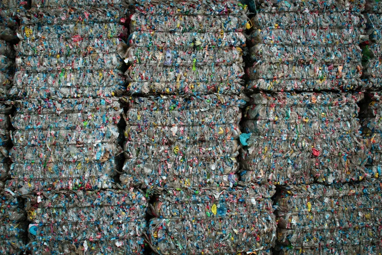 several rows of crushed up plastic bottle caps