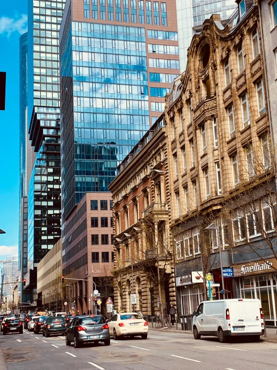 a very busy city street with tall buildings