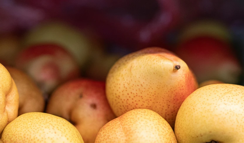 a close - up view of apples and oranges
