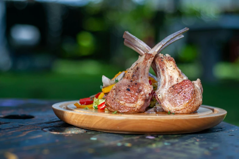 two stuffed meats on a wooden platter