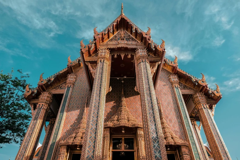 large wooden building with decorative design and two doors