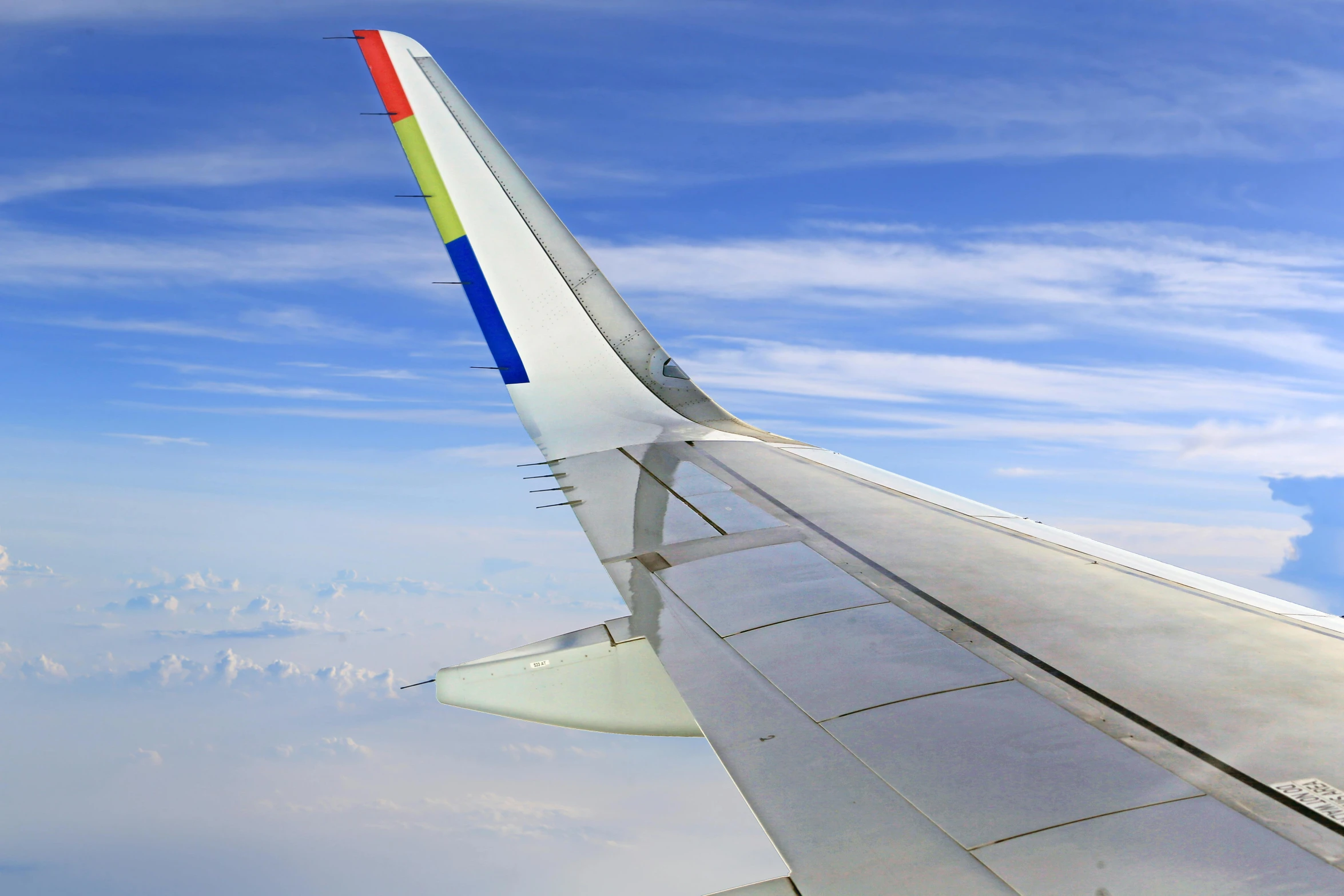 the tail end of an airplane in flight