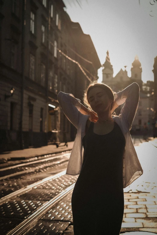 a woman with her arms around her body